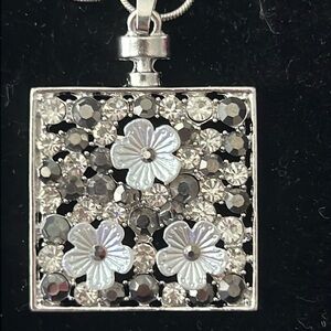 FLOWER AND CRYSTALS ON ALLOY PENDENT WITH 18” STERLING SNAKE CHAIN